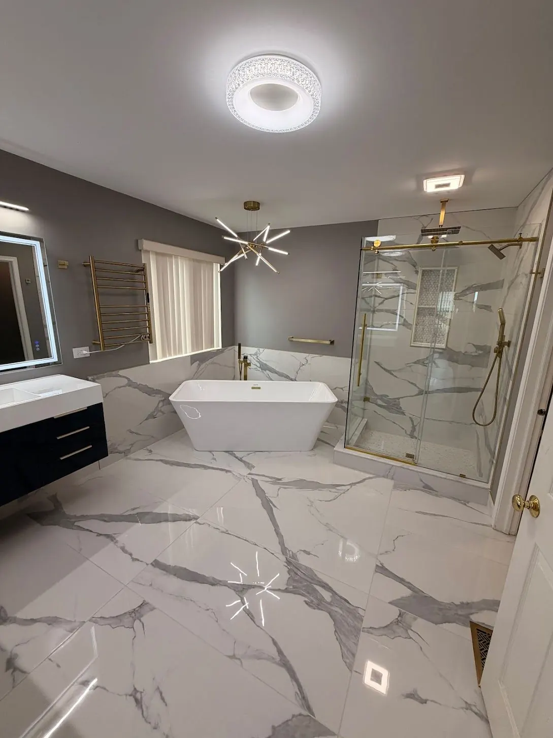 Finished bathroom showing painted wall and door beside the tiled tub